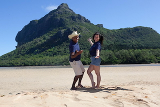 Allan & Heidi on the beach posing before Le Morne Mountain